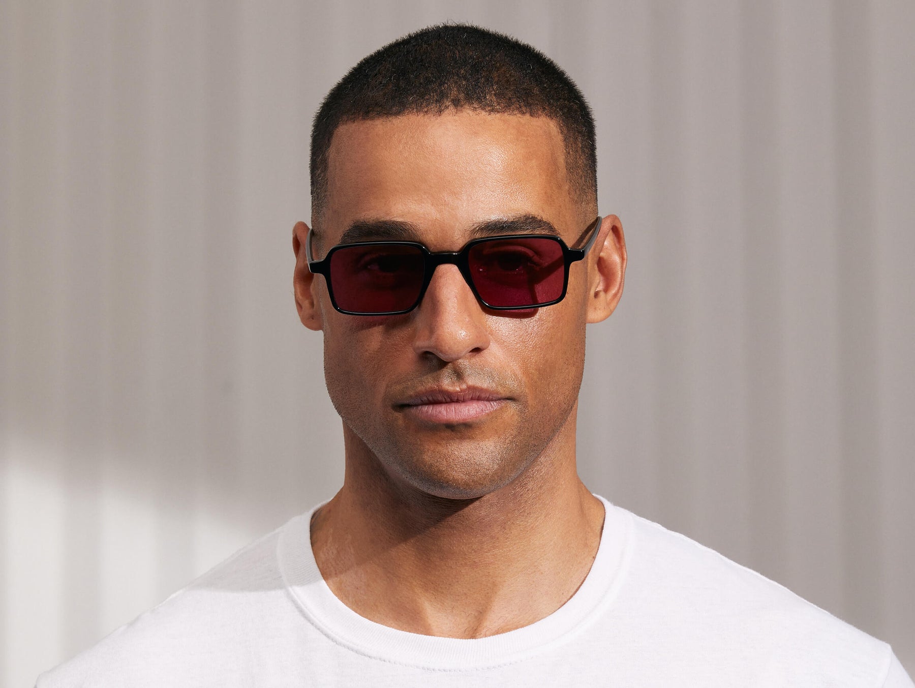 Model is wearing The SHINDIG Black in size 50 with Purple Nurple Tinted Lenses