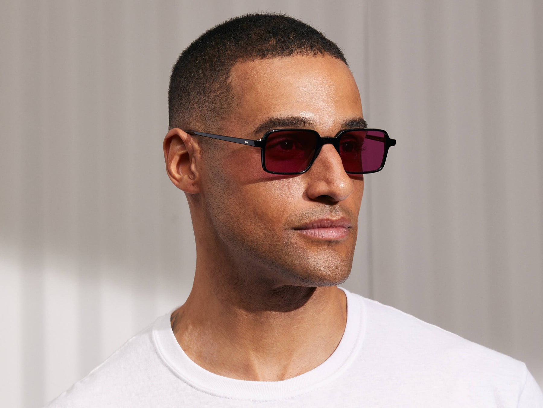 Model is wearing The SHINDIG Black in size 50 with Purple Nurple Tinted Lenses