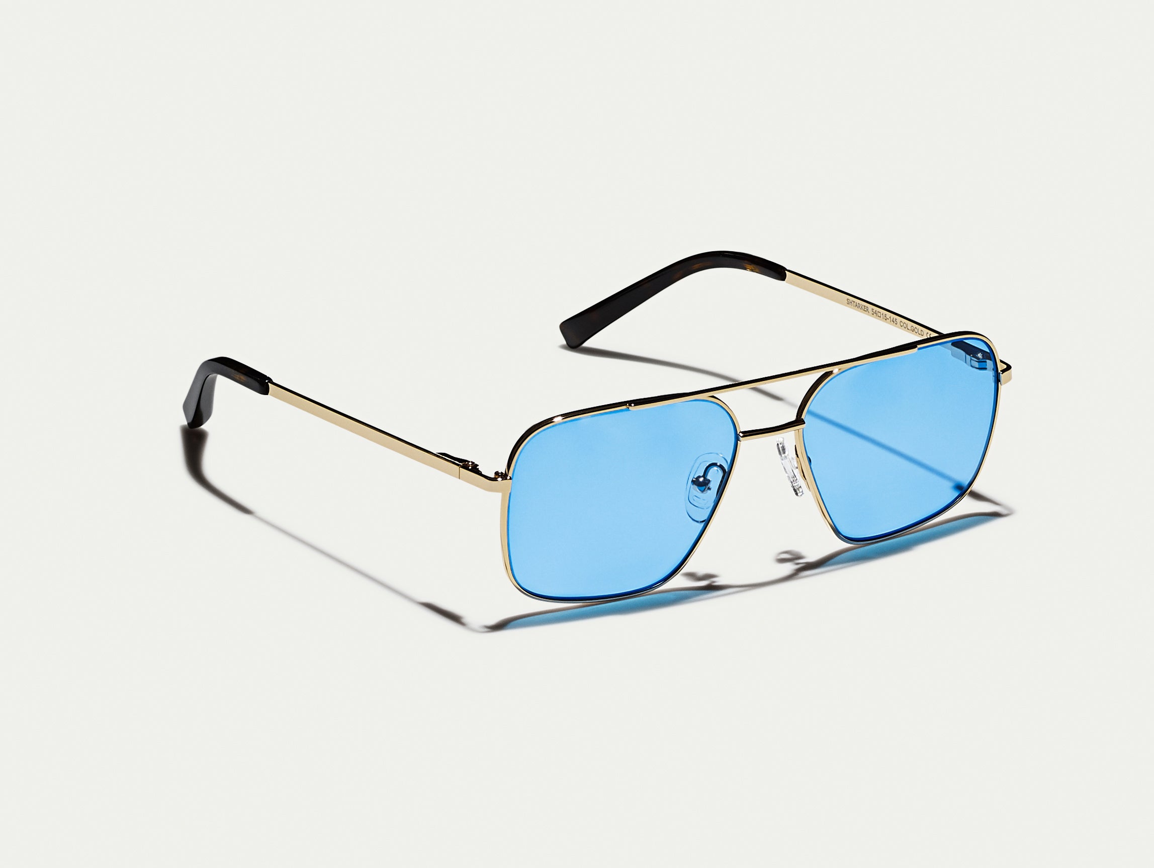 The SHTARKER in Gold with Celebrity Blue Tinted Lenses