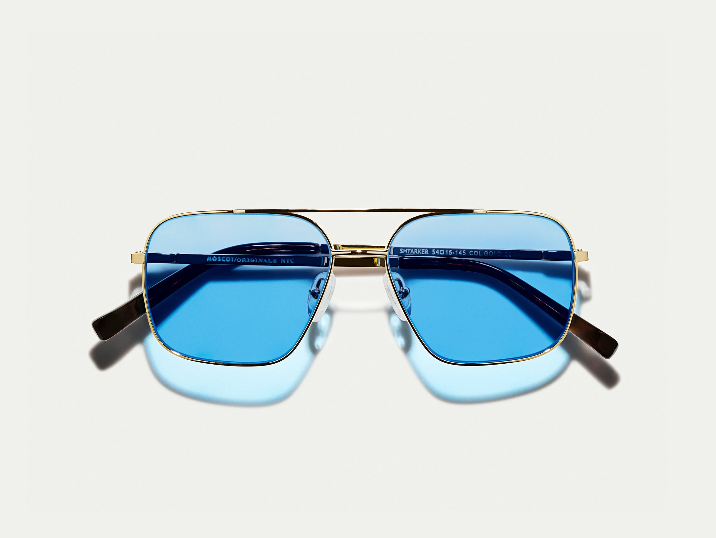 #color_celebrity blue | The SHTARKER in Gold with Celebrity Blue Tinted Lenses