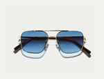 The SHTARKER in Gold with Denim Blue Tinted Lenses