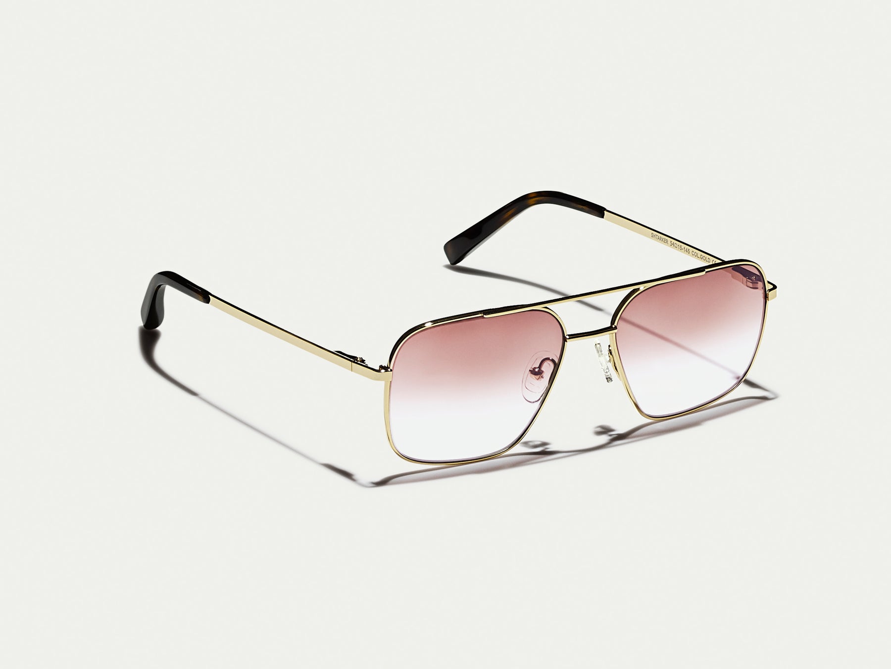 The SHTARKER in Gold with Root Beer Fade Tinted Lenses