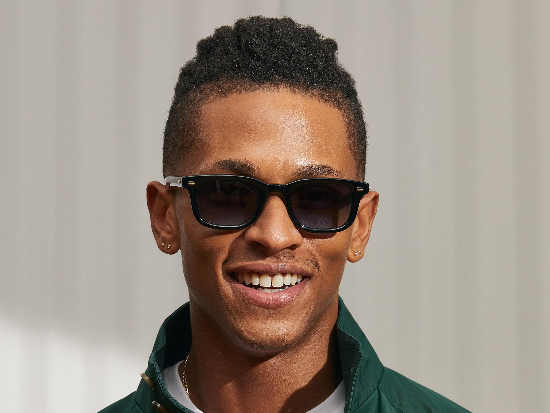 Model is wearing The KLUTZ SUN in Black in size 50 with Denim Blue Tinted Lenses