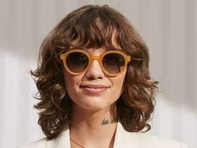 Model is wearing The GREPS SUN in Honey/Tortoise in size 47 with Forest Wood Tinted Lenses