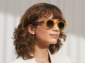 Model is wearing The GREPS SUN in Honey/Tortoise in size 47 with Forest Wood Tinted Lenses