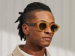 Model is wearing The GREPS SUN in Honey/Tortoise in size 47 with Forest Wood Tinted Lenses
