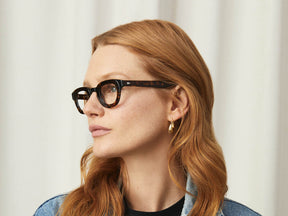 Model is wearing The TELENA in Tortoise/Black in size 41 with Blue Protect Lenses