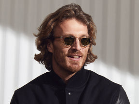 Model is wearing the TELENA SUN in Cinnamon/Flesh in size 44 with Calibar Green Glass Lenses