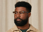 Model is wearing The TINIF in size 48 in Tortoise/Gold