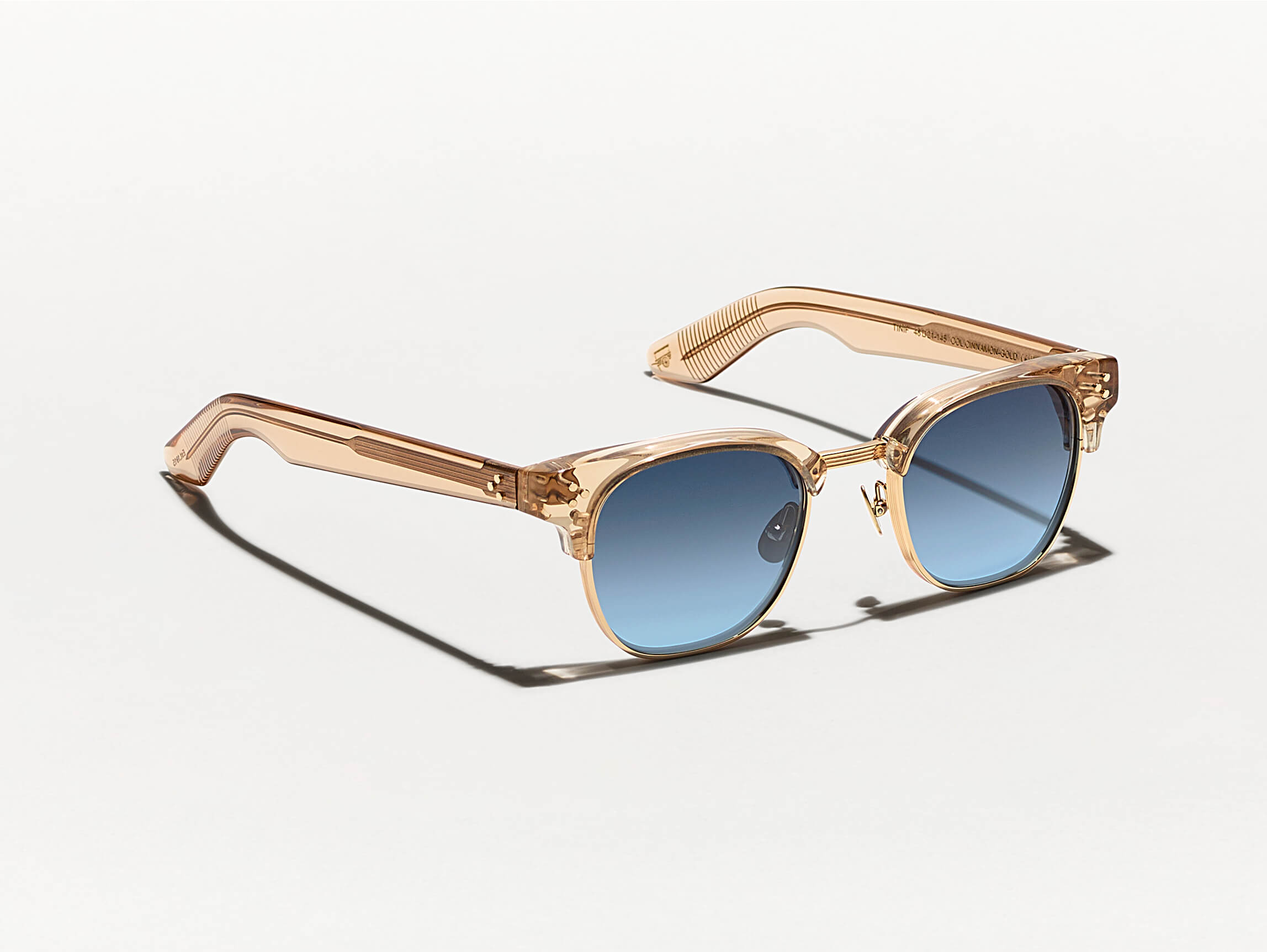 The TINIF SUN in Cinnamon/Gold with Denim Blue Tinted Lenses