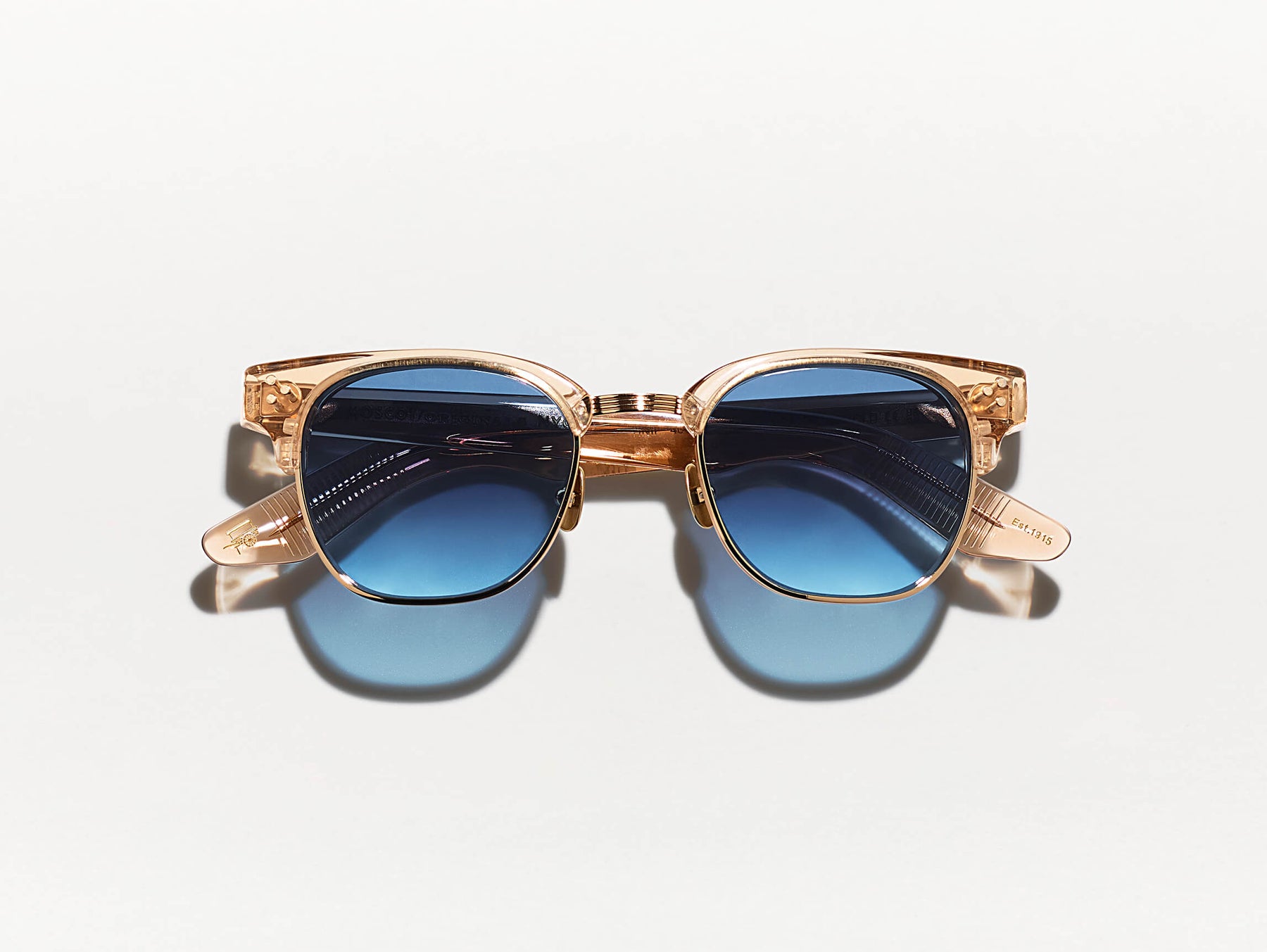 The TINIF SUN in Cinnamon/Gold with Denim Blue Tinted Lenses