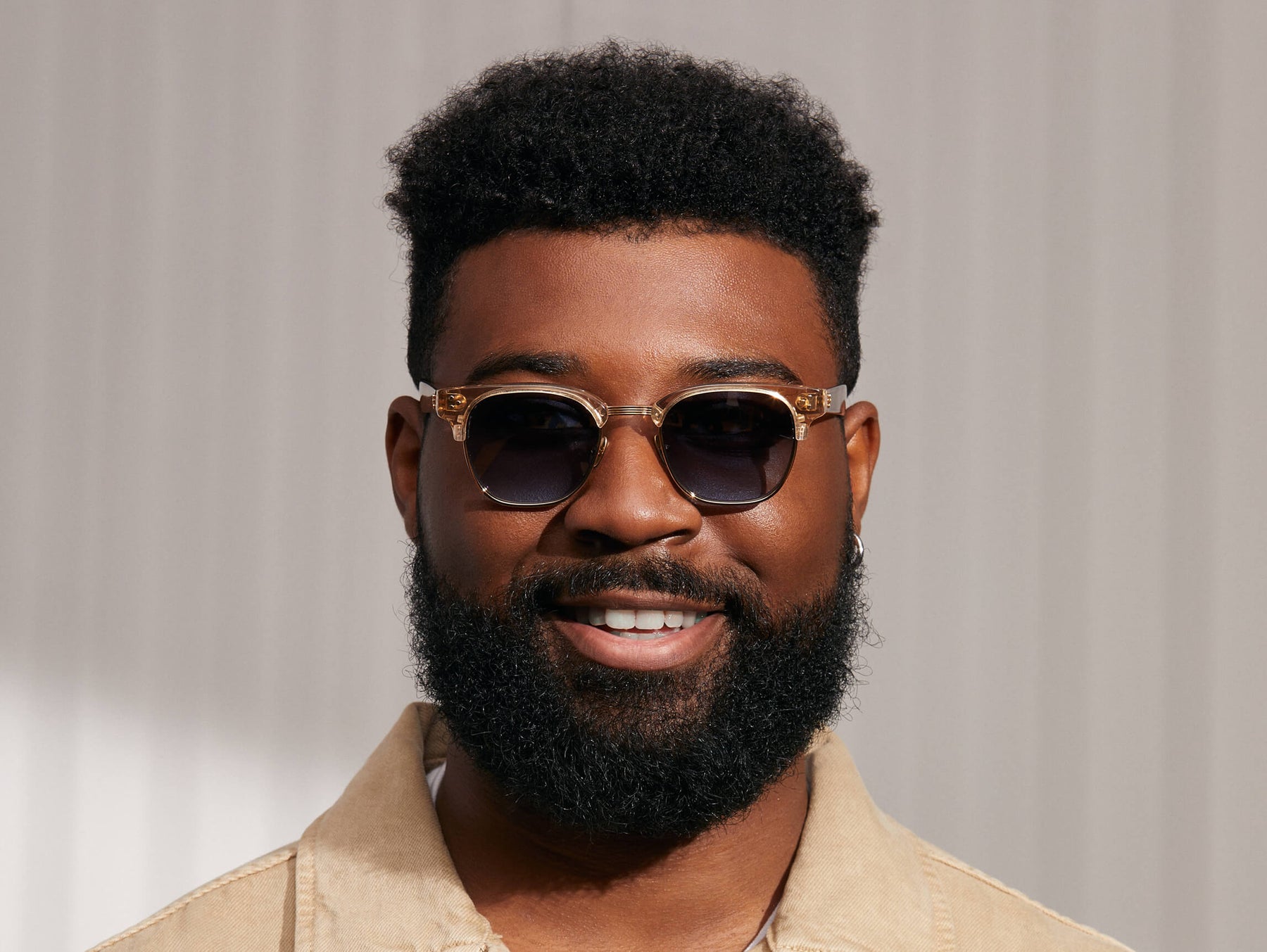 Model is wearing The TINIF SUN in Cinnamon/Gold in size 48 with Denim Blue Tinted Lenses