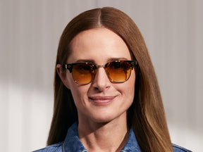 Model is wearing The TINIF SUN in Tortoise/Gold in size 48 with Chestnut Fade Tinted Lenses