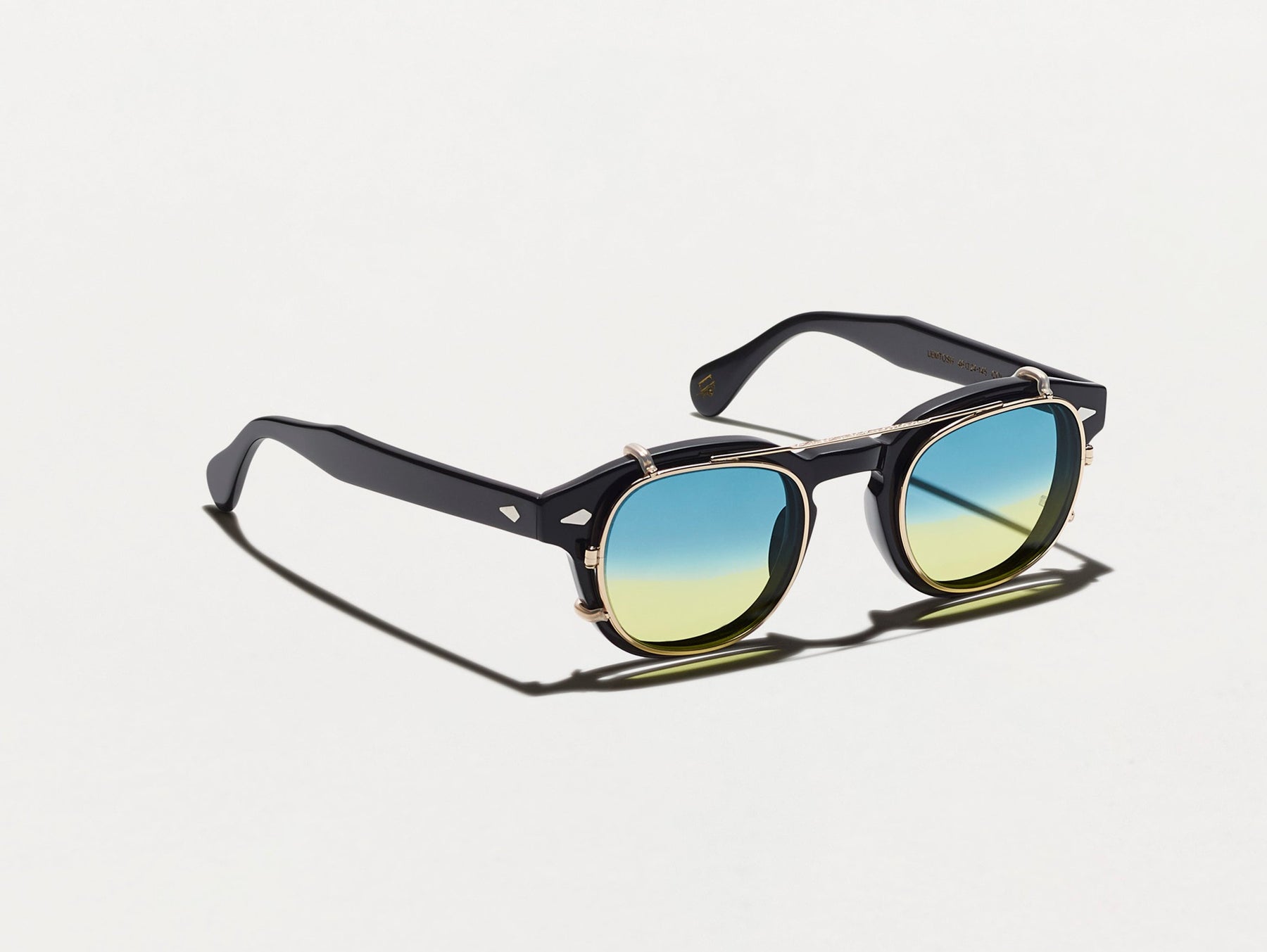 The CLIPTOSH in Gold with Aqua Sunrise Tinted Lenses