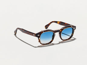 The CLIPTOSH in Gold with Broadway Blue Fade Tinted Lenses