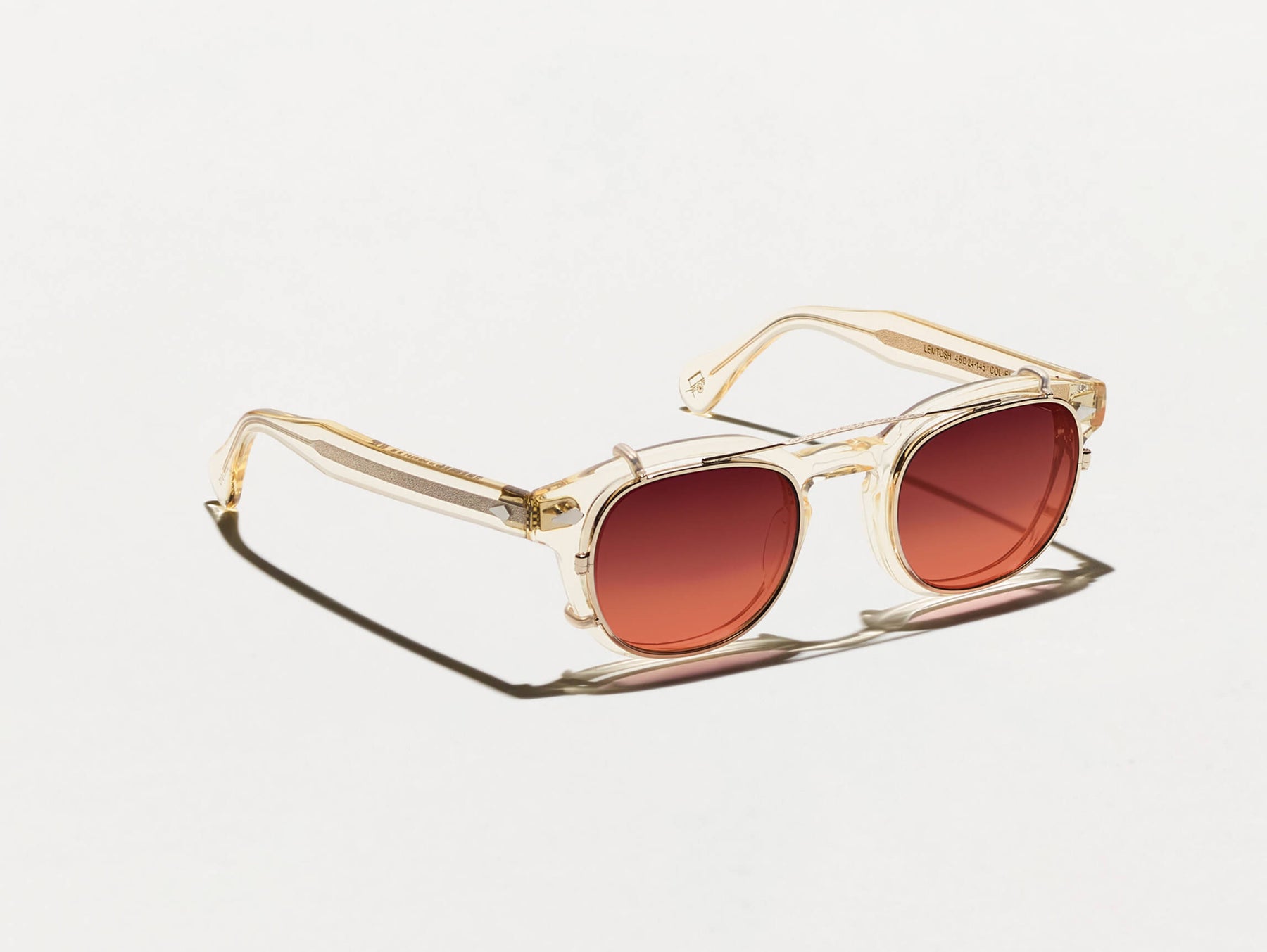 The CLIPTOSH in Gold with Cabernet Tinted Lenses