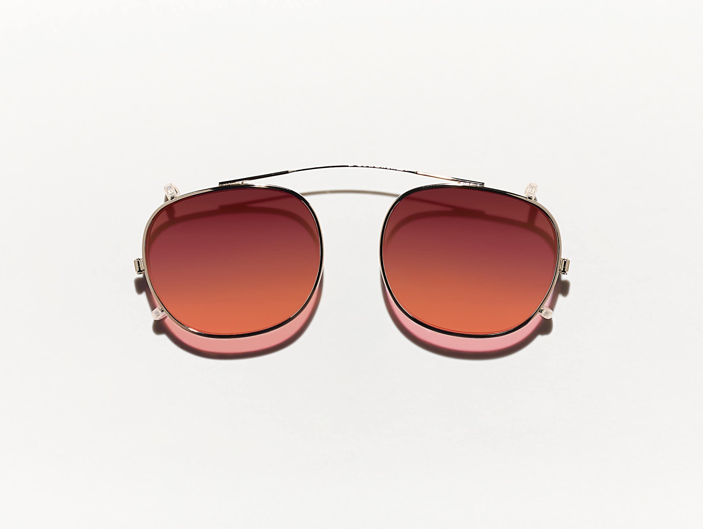 The CLIPTOSH in Gold with Cabernet Tinted Lenses