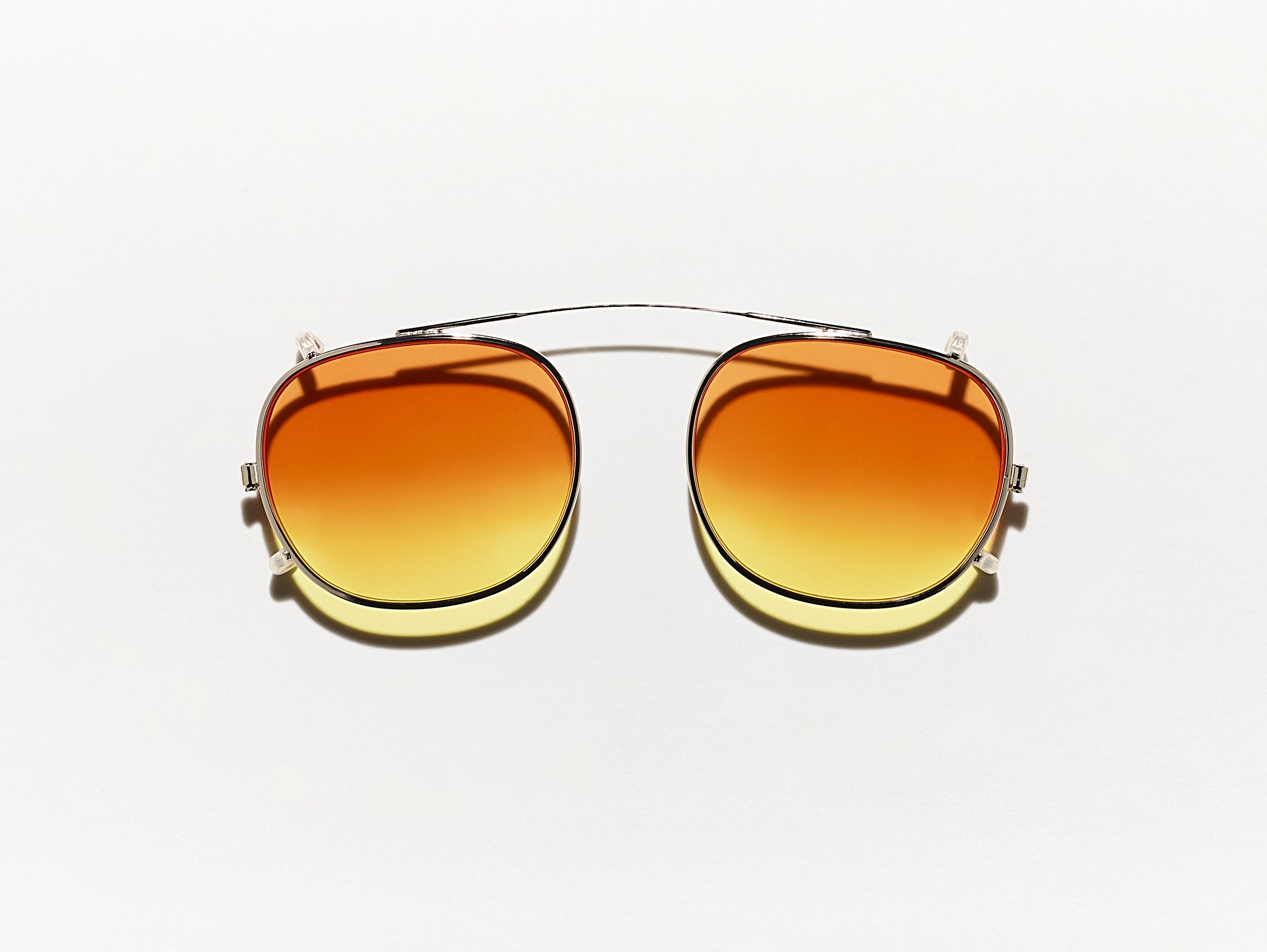 The CLIPTOSH in Gold with Candy Corn Tinted Lenses