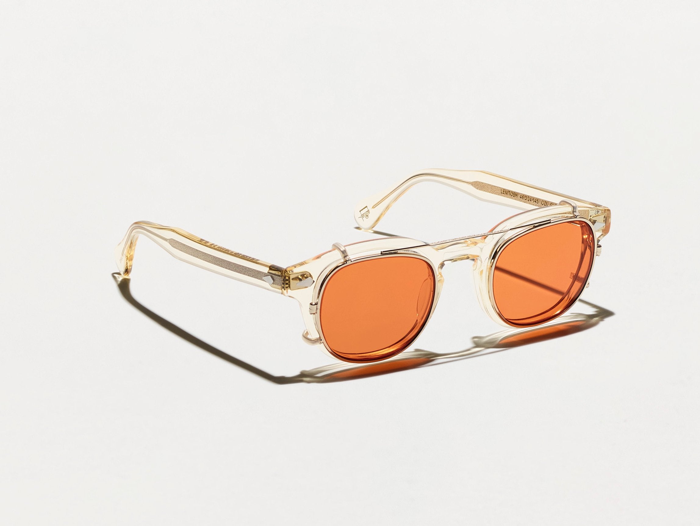 The CLIPTOSH in Gold with Woodstock Orange Tinted Lenses