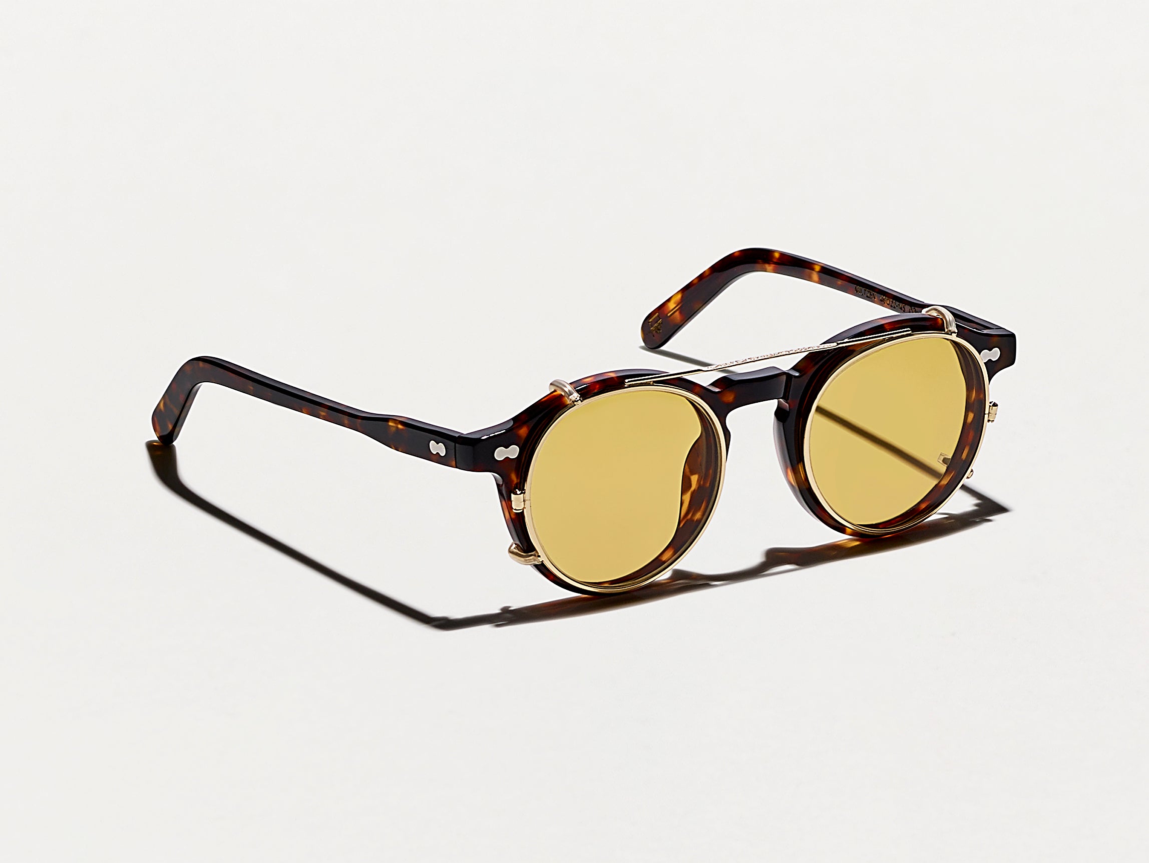 The CLIPZEN in Gold with Amber Tinted Lenses