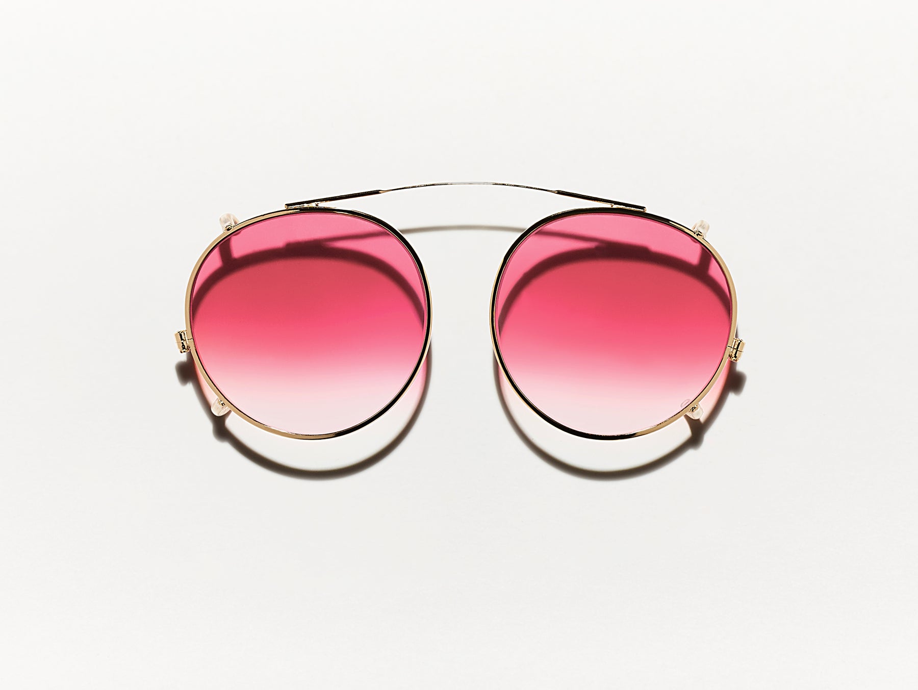 The CLIPZEN in Gold with Big Apple Fade Tinted Lenses