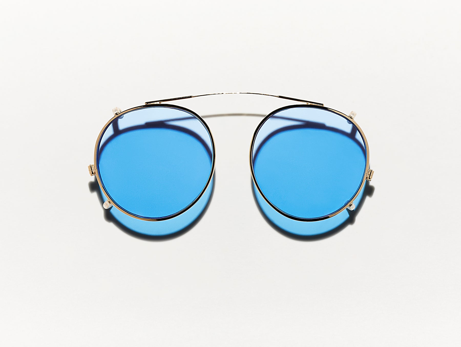 The CLIPZEN in Gold with Celebrity Blue Tinted Lenses