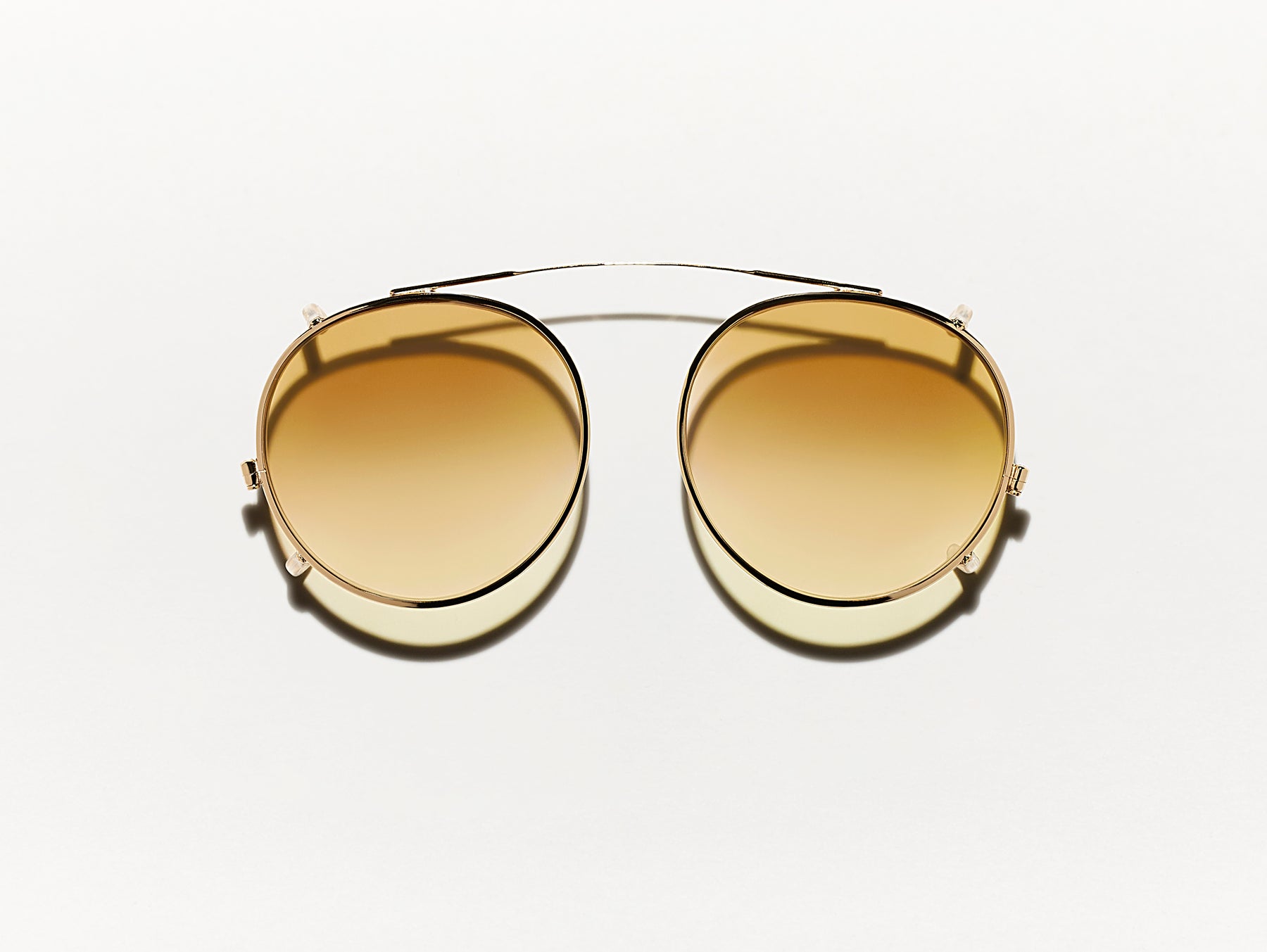 The CLIPZEN in Gold with Chestnut Fade Tinted Lenses