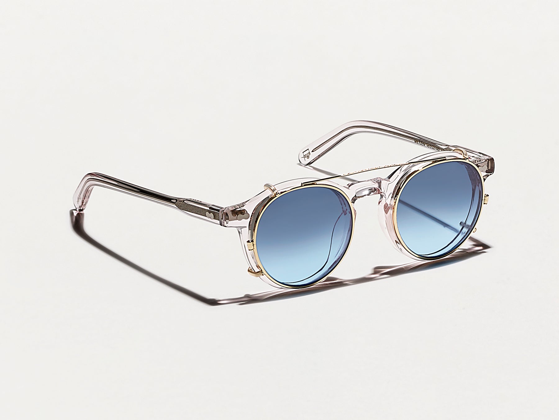 The CLIPZEN in Gold with Denim Blue Tinted Lenses