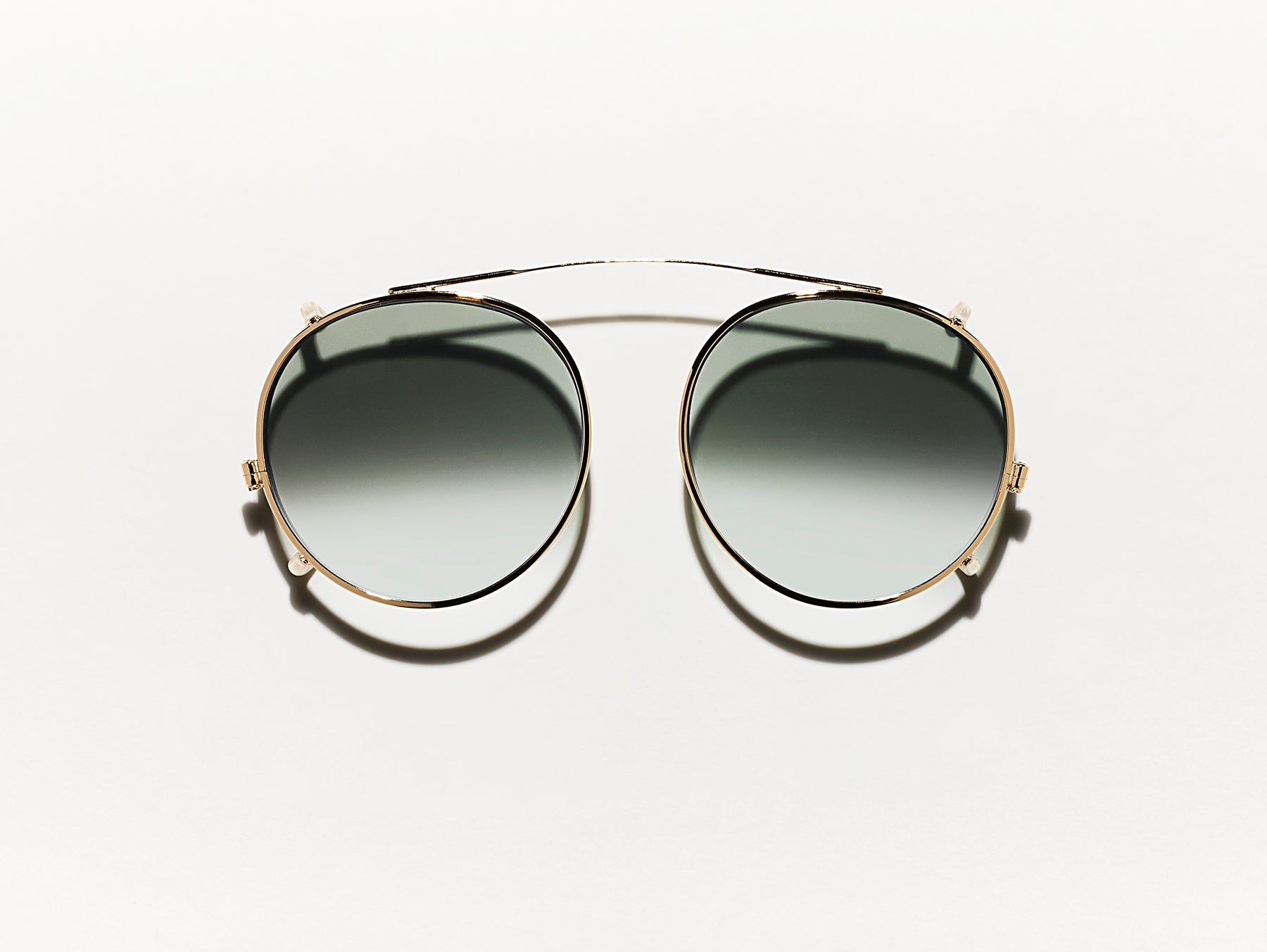 The CLIPZEN in Gold with G-15 Fade Tinted Lenses