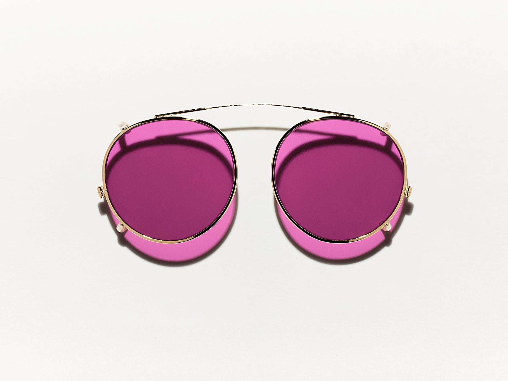 The CLIPZEN in Gold with Purple Nurple Tinted Lenses