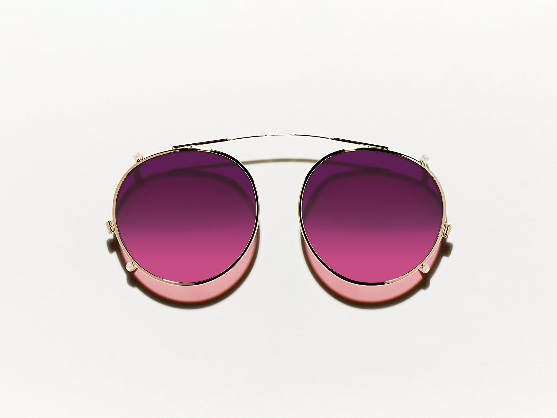 The CLIPZEN in Gold with Westside Sunset Tinted Lenses