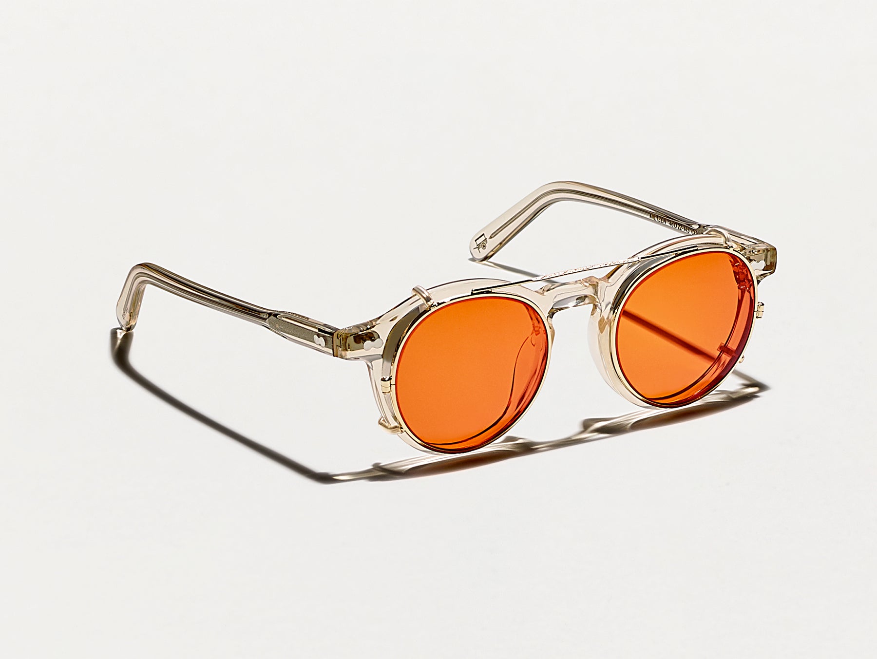 The CLIPZEN in Gold with Woodstock Orange Tinted Lenses