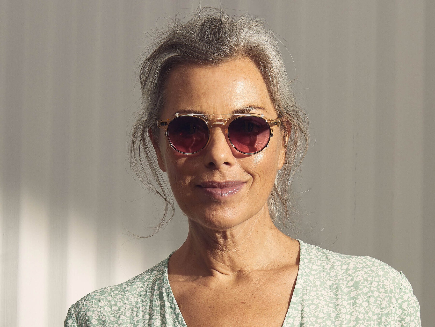 Model is wearing The CLIPZEN in Gold in size 46 with Westside Sunset Tinted Lenses