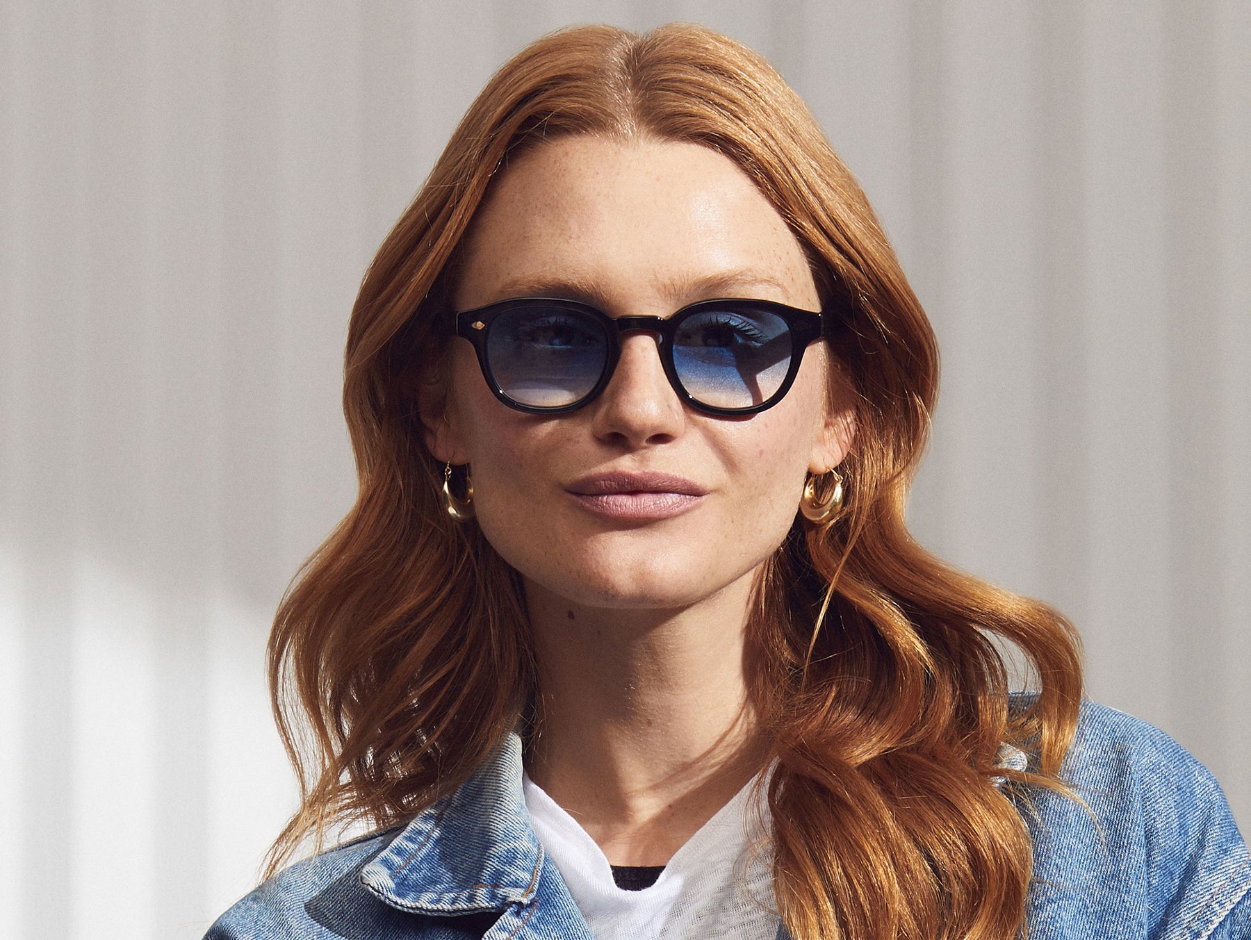 Model is wearing The LEMTOSH in Black in size 49 with Broadway Blue Fade Tinted Lenses