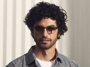 Model is wearing The LEMTOSH in Light Grey in size 46 with American Grey Fade Tinted Lenses