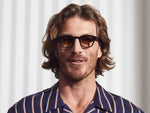 Model is wearing The LEMTOSH in Black in size 46 with Chestnut Fade Tinted Lenses