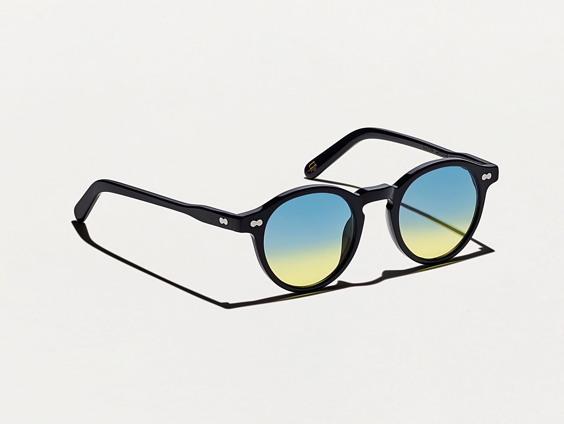 The MILTZEN Black with Aqua Sunrise Tinted Lenses