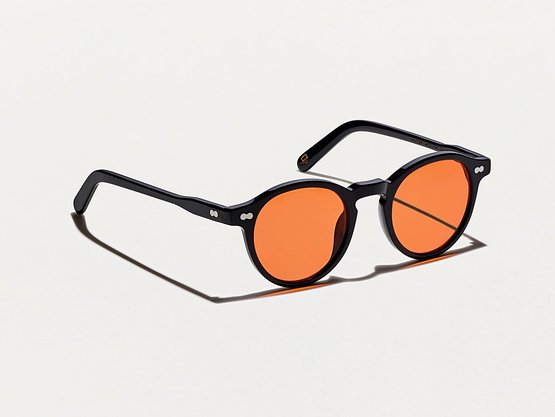 The MILTZEN Black with Woodstock Orange Tinted Lenses
