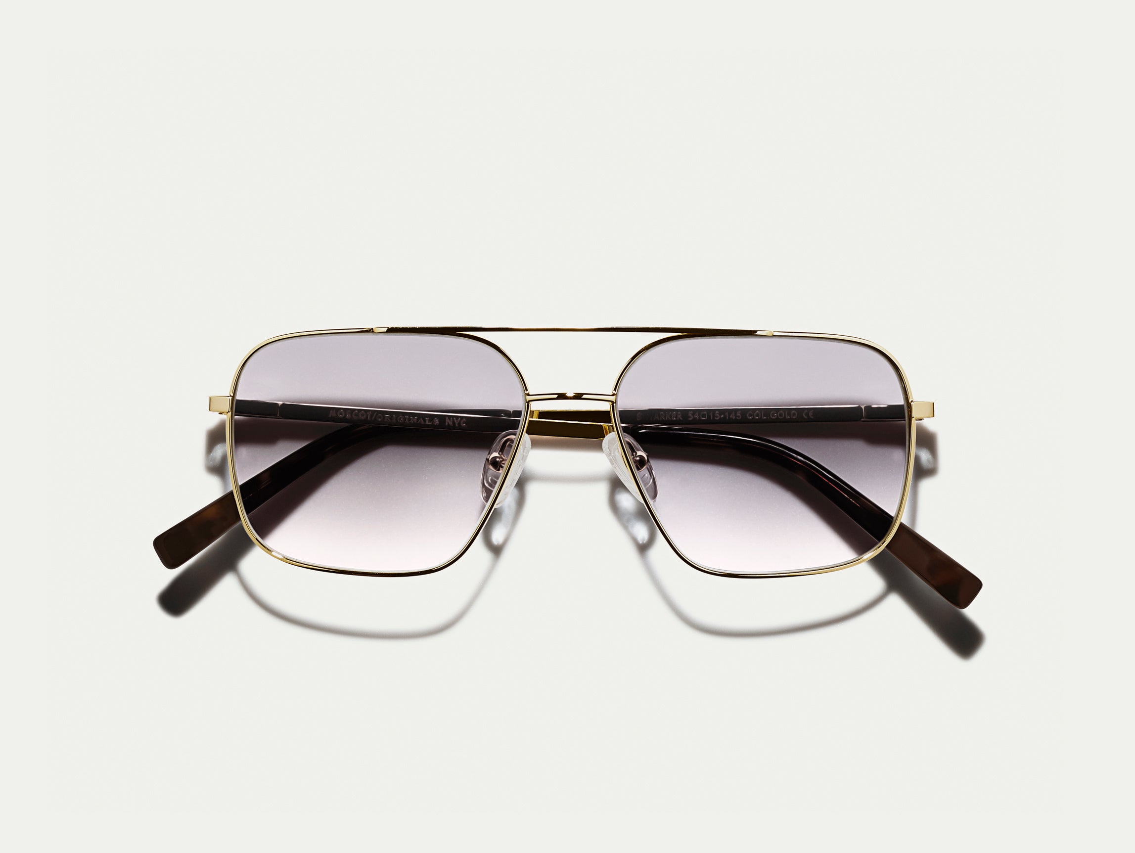 The SHTARKER in Gold with American Grey Fade Tinted Lenses
