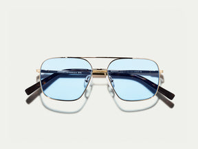 The SHTARKER in Gold with Bel Air Blue Tinted Lenses