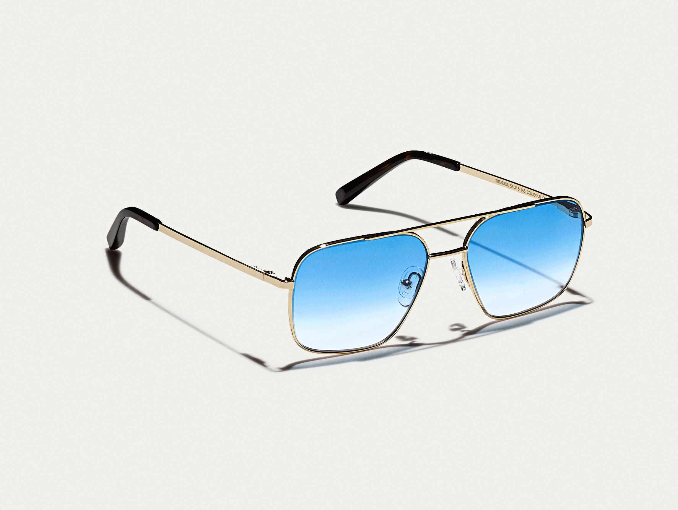 The SHTARKER in Gold with Broadway Blue Fade Tinted Lenses