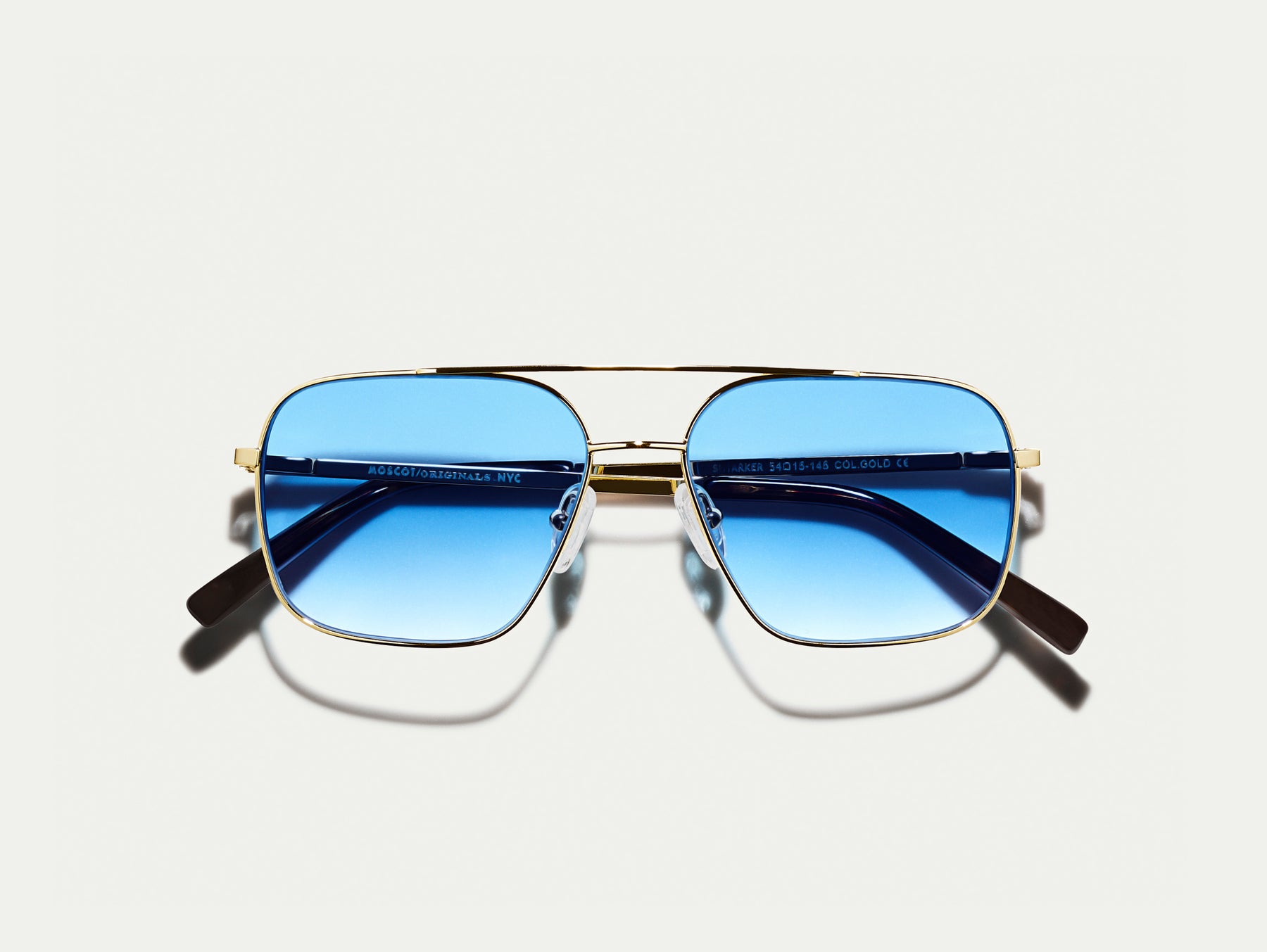 The SHTARKER in Gold with Broadway Blue Fade Tinted Lenses