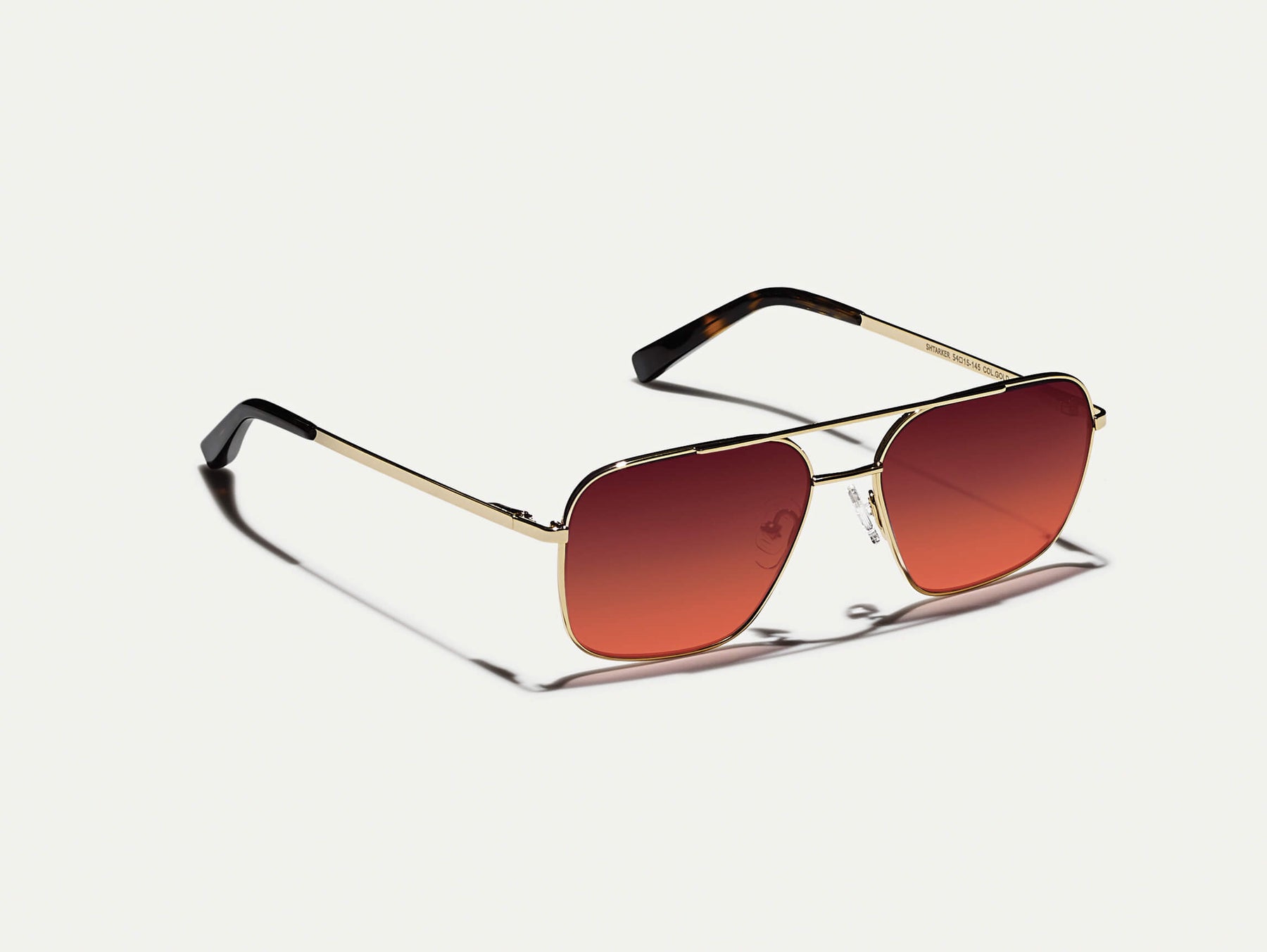 The SHTARKER in Gold with Cabernet Tinted Lenses