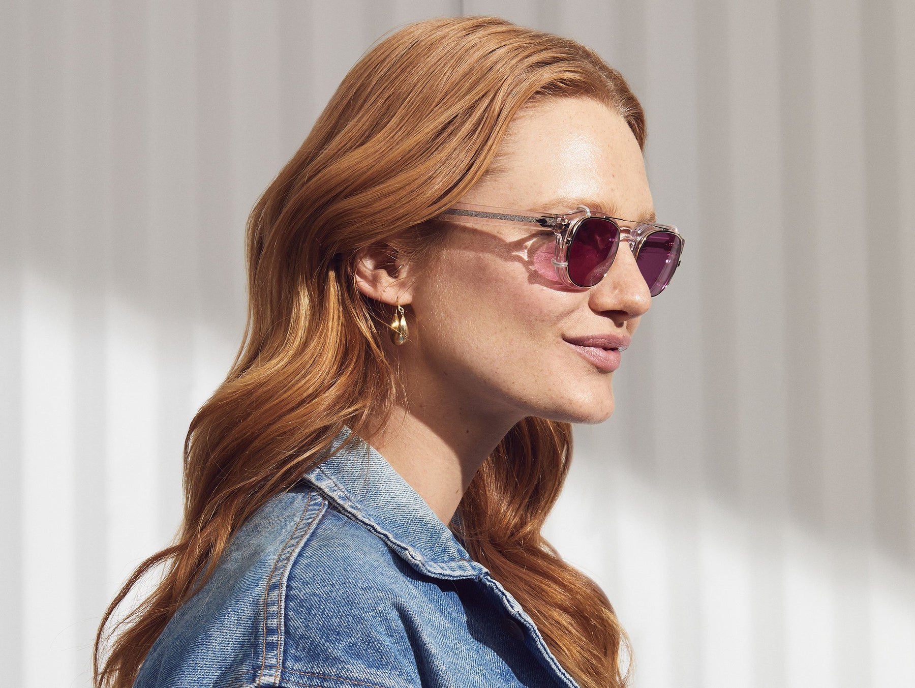 Model is wearing The CLIPTOSH in Gold in size 46 with Purple Nurple Tinted Lenses
