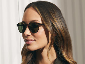 Model is wearing The VANTZ SUN in Brown/Bamboo in size 50 with G-15 Glass Lenses