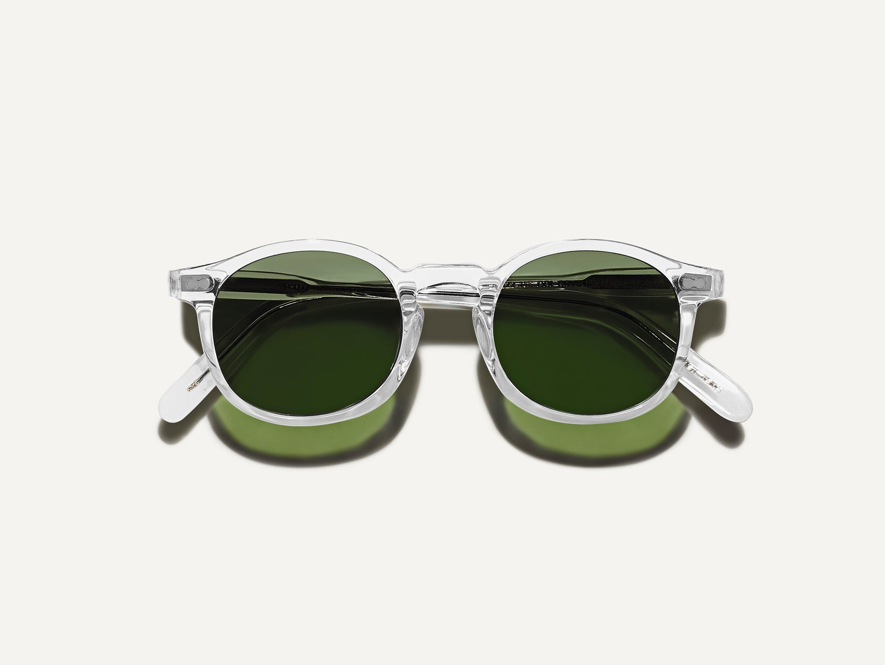 The VELVYL SUN in Crystal with Calibar Green Glass Lenses
