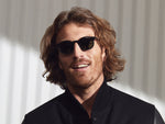 Model is wearing The VELVYL SUN in Black size 46 with G-15 Glass Lenses