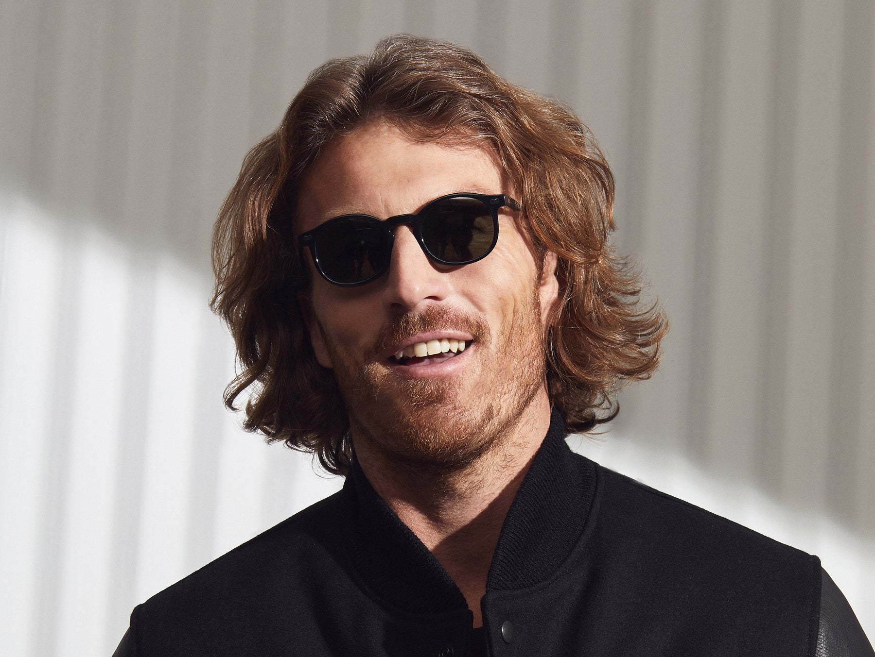 Model is wearing The VELVYL SUN in Black size 46 with G-15 Glass Lenses