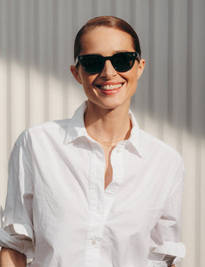 Model is wearing The VILDA SUN in Black in size 51 with G-15 Glass Lenses