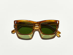 The YONA SUN in Honey Blonde with Calibar Green Glass Lenses